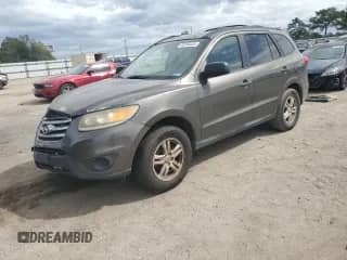 2012 Hyundai Santa Fe GLS z VIN 5XYZG3ABXCG125199, wystawiony jako Copart lot #82244445 z przebiegiem 289 173 mil mil oraz Czysty tytuł • Clean title. Historia ofert i sprzedaży dostępna na DreamBid. Obrazek 1.