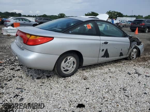 2002 Saturn SC с VIN 1G8ZP12892Z128385, выставлен на аукционе Copart как лот 66945605 с пробегом 134 237 миль миль и Списание • Salvage title. История ставок и продаж доступна на DreamBid. Изображение 3.