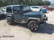 2005 Jeep Wrangler X z VIN 1J4FA39S65P325984, wystawiony jako Copart lot #84242945 z przebiegiem 103 045 mil mil oraz Szkoda całkowita • Salvage title. Historia ofert i sprzedaży dostępna na DreamBid. Obrazek 4.