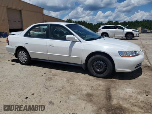 2002 Honda Accord LX with VIN JHMCG56482C030489, listed as a Copart auction lot 66217045 with 124,672 mi miles and Salvage title. Bid and sale history available at DreamBid. Image 4.