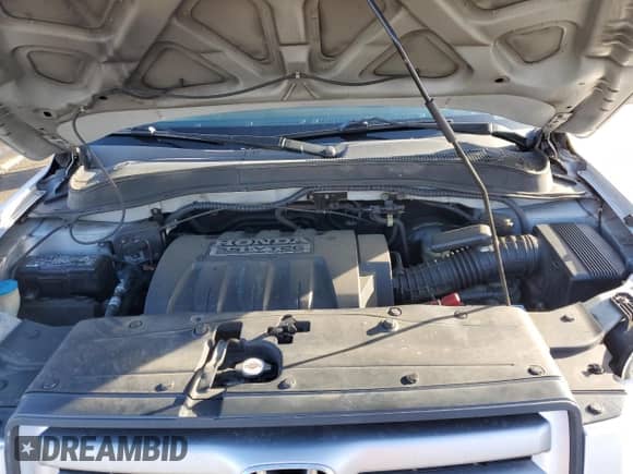 2006 Honda Pilot EX-L z VIN 5FNYF28736B051064, wystawiony jako Copart lot #87474404 z przebiegiem 198 262 mil mil oraz Szkoda całkowita • Salvage title. Historia ofert i sprzedaży dostępna na DreamBid. Obrazek 12.