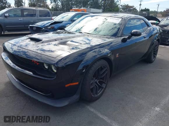 2021 Dodge Challenger R/T Scat Pack Widebody with VIN 2C3CDZFJ7MH677011, listed as a IAAI auction lot 43412091 with 26,783 mi miles and . Bid and sale history available at DreamBid. Image 18.