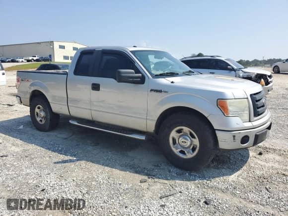 2009 Ford F-150 STX with VIN 1FTRX12W69KB73890, listed as a Copart auction lot 71760015 with 525,469 mi miles and Salvage title. Bid and sale history available at DreamBid. Image 4.