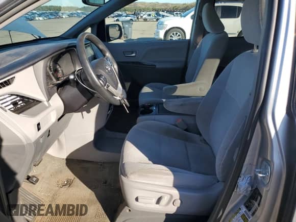 2017 Toyota Sienna LE with VIN 5TDKZ3DC9HS823829, listed as a Copart auction lot 82004525 with 143,268 mi miles and Salvage title. Bid and sale history available at DreamBid. Image 7.