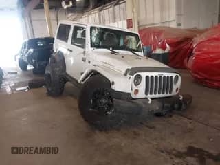 2012 Jeep Wrangler Arctic with VIN 1C4AJWBG9CL233232, listed as a IAAI auction lot 42282805 with 109,927 mi miles and . Bid and sale history available at DreamBid. Image 1.
