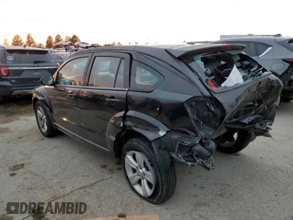 2010 Dodge Caliber Mainstreet with VIN 1B3CB3HAXAD551716, listed as a Copart auction lot 77349503 with 144,209 mi miles and Salvage title. Bid and sale history available at DreamBid. Image 2.
