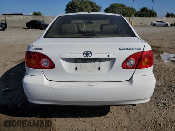 2003 Toyota Corolla LE with VIN JTDBR32E730050858, listed as a Copart auction lot 84818375 with 163,106 mi miles and Salvage title. Bid and sale history available at DreamBid. Image 6.