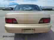 1996 Toyota Camry DX z VIN JT2BG12K5T0407026, wystawiony jako Copart lot #70133315 z przebiegiem 235 855 mil mil oraz Szkoda całkowita • Salvage title. Historia ofert i sprzedaży dostępna na DreamBid. Obrazek 6.