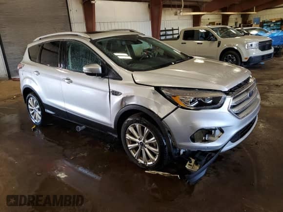 2017 Ford Escape Titanium with VIN 1FMCU9JD1HUA79587, listed as a Copart auction lot 84209285 with 61,058 mi miles and Clean title. Bid and sale history available at DreamBid. Image 4.