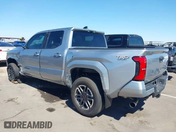 2024 Toyota Tacoma SR5 with VIN 3TMKB5FN2RM001972, listed as a IAAI auction lot 43362889 with 21,644 mi miles and . Bid and sale history available at DreamBid. Image 3.