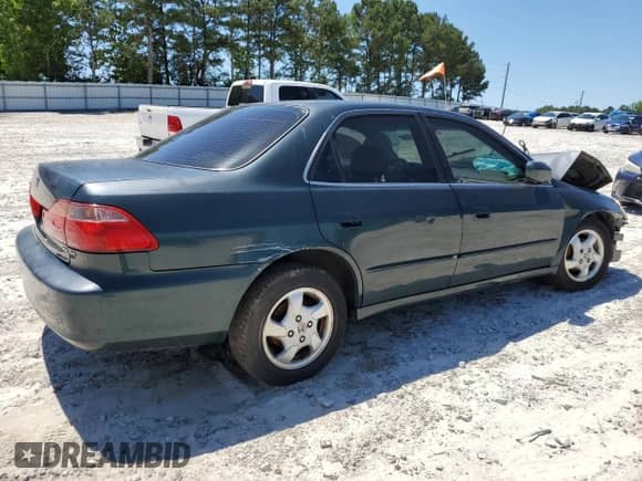 1999 Honda Accord EX with VIN 1HGCG6676XA028911, listed as a Copart auction lot 57597235 with 190,122 mi miles and Salvage title. Bid and sale history available at DreamBid. Image 3.