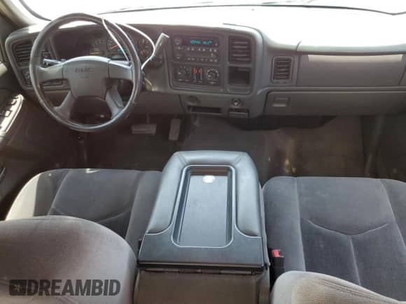 2005 GMC Sierra 1500 SLT z VIN 1GTEK19B45E174285, wystawiony jako Copart lot #59007805 z przebiegiem 166 041 mil mil oraz Szkoda całkowita • Salvage title. Historia ofert i sprzedaży dostępna na DreamBid. Obrazek 8.