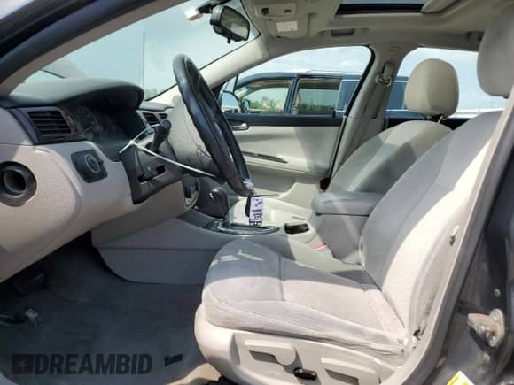 2014 Chevrolet Impala LT z VIN 2G1WB5E32E1152855, wystawiony jako Copart lot #69013875 z przebiegiem 101 915 mil mil oraz Szkoda całkowita • Salvage title. Historia ofert i sprzedaży dostępna na DreamBid. Obrazek 7.