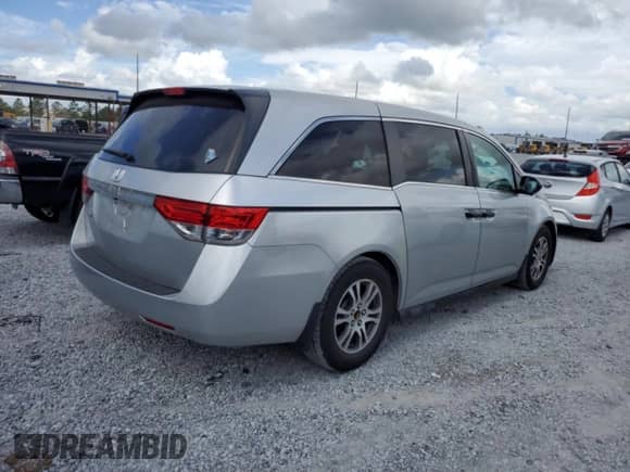 2015 Honda Odyssey LX with VIN 5FNRL5H22FB025431, listed as a Copart auction lot 82373215 with 112,487 mi miles and Salvage title. Bid and sale history available at DreamBid. Image 3.