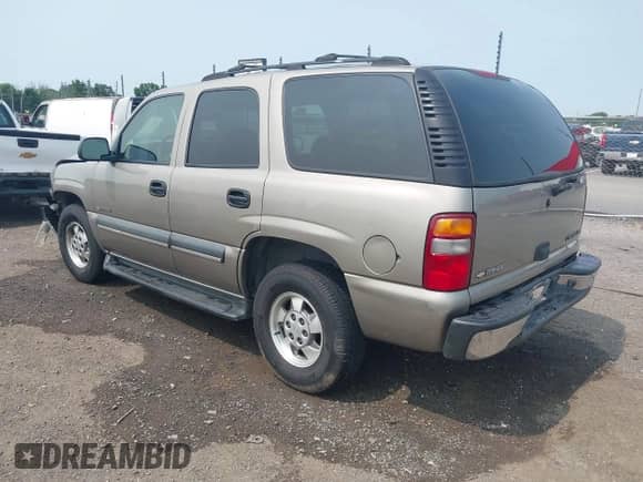 2003 Chevrolet Tahoe LS z VIN 1GNEC13Z43R124163, wystawiony jako IAAI lot #42374254 z przebiegiem 231 335 mil mil oraz . Historia ofert i sprzedaży dostępna na DreamBid. Obrazek 3.