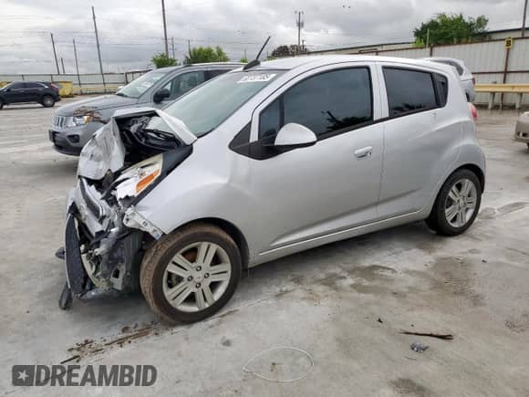 2015 Chevrolet Spark LS with VIN KL8CA6S93FC799149, listed as a Copart auction lot 60737185 with 114,469 mi miles and Salvage title. Bid and sale history available at DreamBid. Image 1.