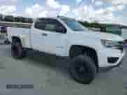 2015 Chevrolet Colorado 2WD WT с VIN 1GCHSAEA5F1275791, выставлен на аукционе Copart как лот 81661045 с пробегом 193 749 миль миль и Чистый • Clean title. История ставок и продаж доступна на DreamBid. Изображение 4.