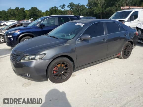 2009 Toyota Camry LE z VIN 4T1BE46K29U296523, wystawiony jako Copart lot #80359865 z przebiegiem 190 864 mil mil oraz Czysty tytuł • Clean title. Historia ofert i sprzedaży dostępna na DreamBid. Obrazek 1.