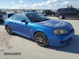 2005 Hyundai Tiburon GS с VIN KMHHM65D55U174910, выставлен на аукционе Copart как лот 72691804 с пробегом 161 764 миль миль и Списание • Salvage title. История ставок и продаж доступна на DreamBid. Изображение 4.
