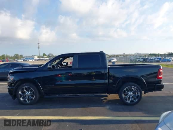2019 Ram 1500 Laramie with VIN 1C6RREJT7KN792423, listed as a IAAI auction lot 43058571 with 118,086 mi miles and . Bid and sale history available at DreamBid. Image 14.