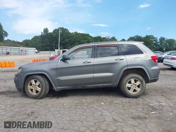 2012 Jeep Grand Cherokee Laredo z VIN 1C4RJEAGXCC209956, wystawiony jako IAAI lot #43042598 z przebiegiem 169 463 mil mil oraz . Historia ofert i sprzedaży dostępna na DreamBid. Obrazek 14.