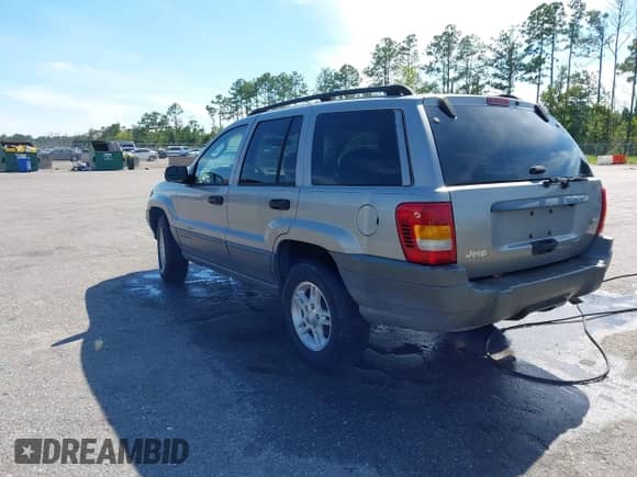 2002 Jeep Grand Cherokee Laredo with VIN 1J4GX48S32C127277, listed as a IAAI auction lot 43125887 with 139,410 mi miles and . Bid and sale history available at DreamBid. Image 3.