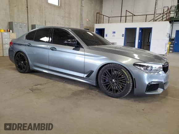 2018 BMW 5 Series M550i xDrive with VIN WBAJB9C51JB034817, listed as a Copart auction lot 69056245 with 132,405 mi miles and Salvage title. Bid and sale history available at DreamBid. Image 4.
