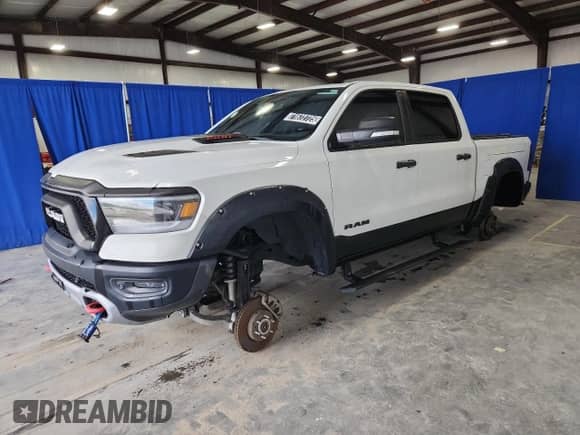 2020 Ram 1500 Rebel z VIN 1C6SRFLT4LN314434, wystawiony jako Copart lot #71672725 z przebiegiem 74 848 mil mil oraz Czysty tytuł • Clean title. Historia ofert i sprzedaży dostępna na DreamBid. Obrazek 1.
