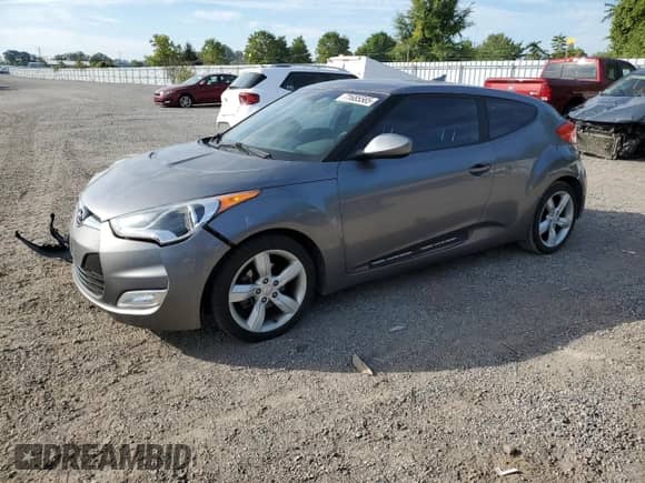 2012 Hyundai Veloster w/Black Int z VIN KMHTC6AD1CU081088, wystawiony jako Copart lot #71685565 z przebiegiem Nie podano mil oraz Szkoda całkowita • Salvage title. Historia ofert i sprzedaży dostępna na DreamBid. Obrazek 1.