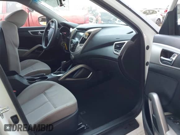 2014 Hyundai Veloster with VIN KMHTC6ADXEU209850, listed as a IAAI auction lot 42726384 with 128,523 mi miles and . Bid and sale history available at DreamBid. Image 5.