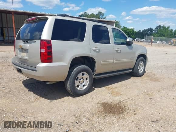 2014 Chevrolet Tahoe LS with VIN 1GNSCAE08ER128141, listed as a IAAI auction lot 42177785 with 108,548 mi miles and . Bid and sale history available at DreamBid. Image 4.