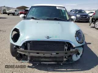 2011 MINI Hardtop with VIN WMWSU3C52BT096248, listed as a Copart auction lot 62008285 with 129,794 mi miles and Salvage title. Bid and sale history available at DreamBid. Image 5.