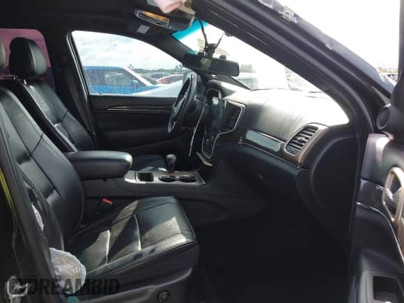 2015 Jeep Grand Cherokee Overland with VIN 1C4RJECG3FC841263, listed as a IAAI auction lot 43293918 with 158,583 mi miles and . Bid and sale history available at DreamBid. Image 5.