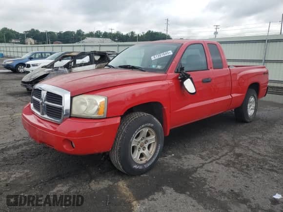2006 Dodge Dakota SLT with VIN 1D7HW42K06S516403, listed as a Copart auction lot 61391645 with 56,737 mi miles and Salvage title. Bid and sale history available at DreamBid. Image 1.