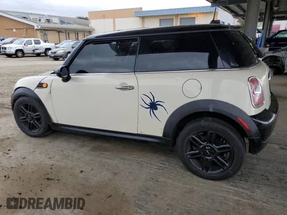 2013 MINI Hardtop with VIN WMWSU3C51DT691076, listed as a Copart auction lot 48066455 with 143,002 mi miles and Salvage title. Bid and sale history available at DreamBid. Image 2.