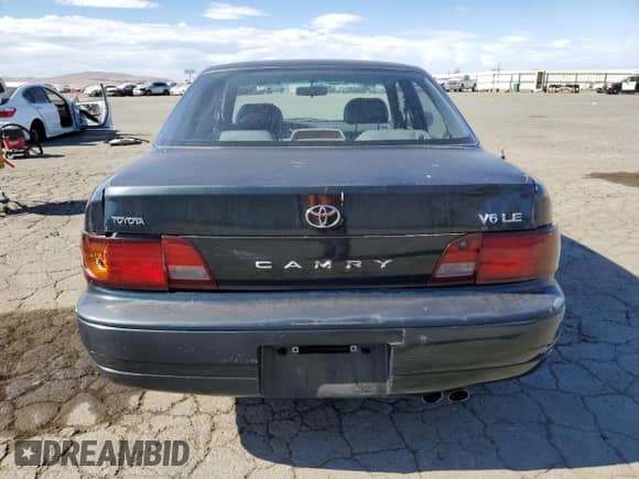 1995 Toyota Camry LE z VIN JT2GK12E3S0117364, wystawiony jako Copart lot #65818255 z przebiegiem 215 464 mil mil oraz Szkoda całkowita • Salvage title. Historia ofert i sprzedaży dostępna na DreamBid. Obrazek 6.