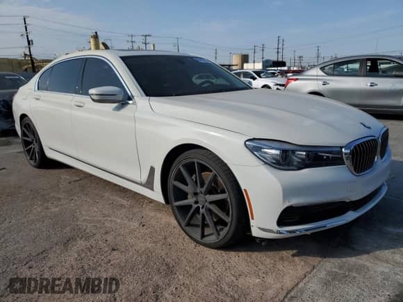 2017 BMW 7 Series 740i xDrive with VIN WBA7E4C59HGU99458, listed as a Copart auction lot 65413575 with 80,859 mi miles and Salvage title. Bid and sale history available at DreamBid. Image 4.
