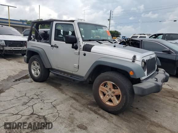2012 Jeep Wrangler Sport с VIN 1C4AJWAG6CL267694, выставлен на аукционе Copart как лот 63449144 с пробегом 86 642 миль миль и Списание • Salvage title. История ставок и продаж доступна на DreamBid. Изображение 4.
