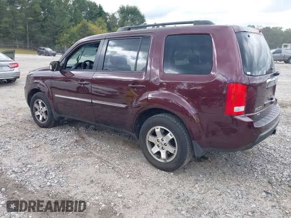 2011 Honda Pilot Touring with VIN 5FNYF4H92BB050639, listed as a IAAI auction lot 43329338 with 171,365 mi miles and . Bid and sale history available at DreamBid. Image 3.