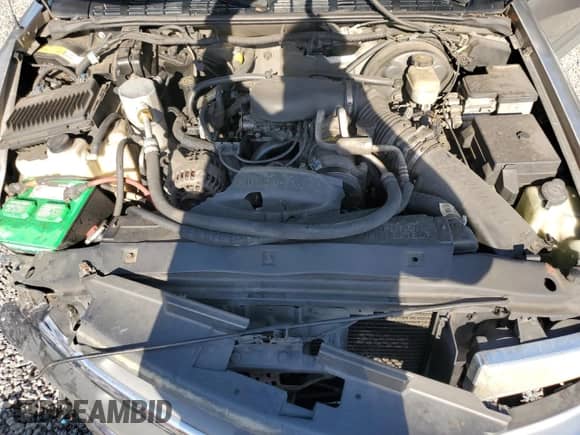 2000 Chevrolet Blazer LS z VIN 1GNCS13W7Y2376702, wystawiony jako Copart lot #52489605 z przebiegiem 137 692 mil mil oraz Szkoda całkowita • Salvage title. Historia ofert i sprzedaży dostępna na DreamBid. Obrazek 12.