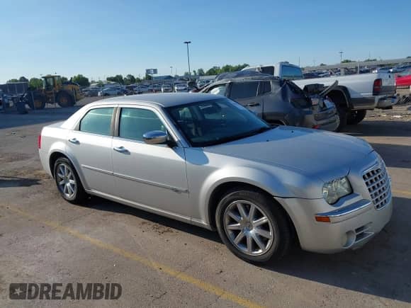 2008 Chrysler 300 C Hemi with VIN 2C3KA63H08H335426, listed as a IAAI auction lot 42742704 with 156,093 mi miles and . Bid and sale history available at DreamBid. Image 1.