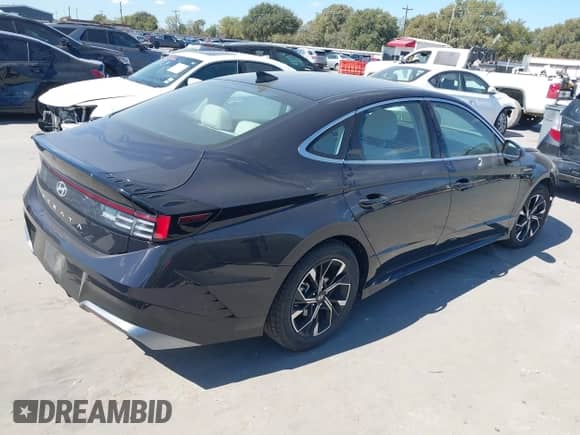 2025 Hyundai Sonata SEL with VIN KMHL64JAXSA439998, listed as a IAAI auction lot 43432349 with 22,906 mi miles and . Bid and sale history available at DreamBid. Image 4.