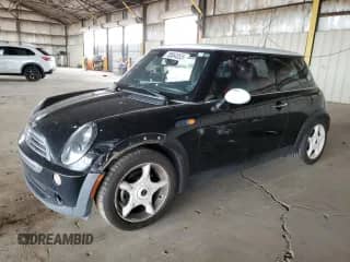 2005 MINI Hardtop with VIN WMWRC33435TJ67146, listed as a Copart auction lot 70664055 with 143,957 mi miles and Salvage title. Bid and sale history available at DreamBid. Image 1.