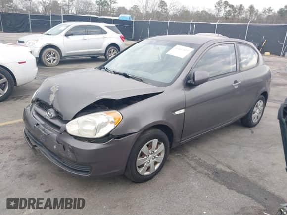 2010 Hyundai Accent Blue z VIN KMHCM3AC1AU158686, wystawiony jako IAAI lot #41466819 z przebiegiem 142 241 mil mil oraz . Historia ofert i sprzedaży dostępna na DreamBid. Obrazek 2.