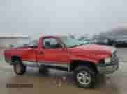 1997 Dodge 1500 with VIN 1B7HF16Z5VJ519902, listed as a Copart auction lot 86356134 with 191,147 mi miles and Salvage title. Bid and sale history available at DreamBid. Image 4.