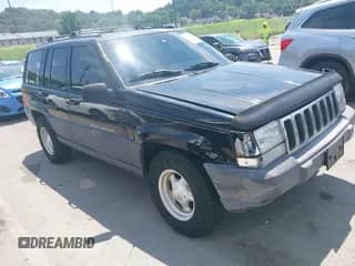 1996 Jeep Grand Cherokee Laredo with VIN 1J4GZ58S0TC247197, listed as a IAAI auction lot 42845213 with 179,858 mi miles and . Bid and sale history available at DreamBid. Image 1.