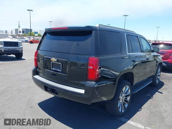 2017 Chevrolet Tahoe LT with VIN 1GNSCBKC2HR132565, listed as a IAAI auction lot 42624889 with 124,105 mi miles and . Bid and sale history available at DreamBid. Image 4.