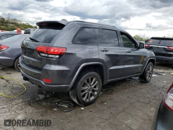 2016 Jeep Grand Cherokee Limited with VIN 1C4RJFBT4GC489199, listed as a Copart auction lot 74453414 with 136,474 mi miles and Salvage title. Bid and sale history available at DreamBid. Image 3.