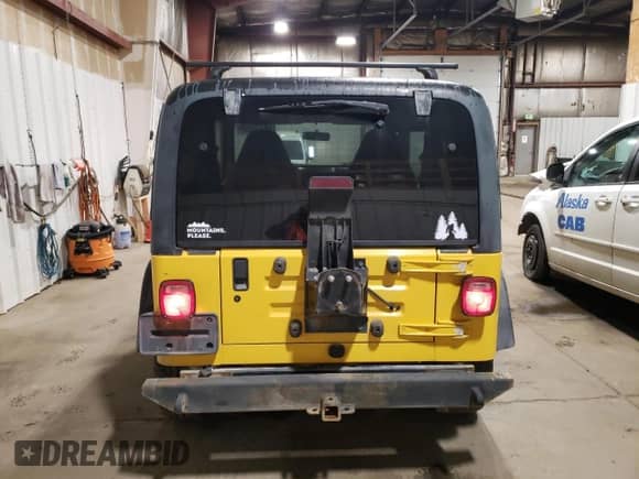 2000 Jeep Wrangler Sport z VIN 1J4FA49S7YP735946, wystawiony jako Copart lot #68370665 z przebiegiem 201 407 mil mil oraz Szkoda całkowita • Salvage title. Historia ofert i sprzedaży dostępna na DreamBid. Obrazek 6.