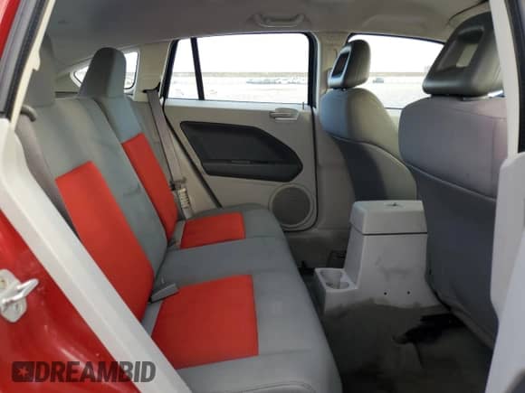 2007 Dodge Caliber SXT z VIN 1B3HB48B67D159555, wystawiony jako Copart lot #71751074 z przebiegiem 117 862 mil mil oraz Szkoda całkowita • Salvage title. Historia ofert i sprzedaży dostępna na DreamBid. Obrazek 11.